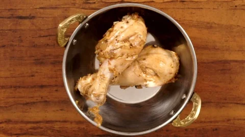 Top Angle Shot of Serving Hot Chicken Drumsticks on a Shiny Steel Bowl 動画素材 82838499