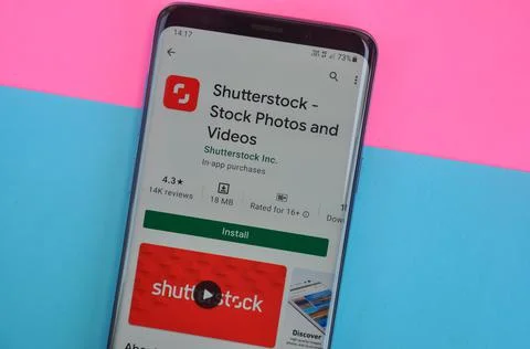 Top angle shot of Shutterstock app displaying on Google Play Store Stock Photos