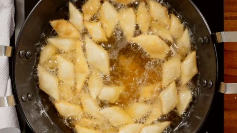 Top Angle Shot of Snacks frying in coconut oil Stock Footage 82819741