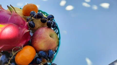 Top angle, tropical fruit grapes, oranges, dragon fruit, pears and apples on  Stock Photos