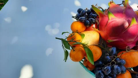 Top angle, tropical fruit grapes, oranges, dragon fruit, pears and apples on  Stock Photos