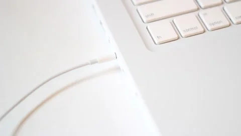 Top angle - Unplugging/plugging in audio jack computer Stock Footage 4502855