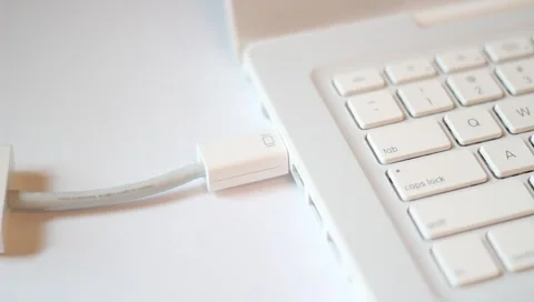 Top angle - Unplugging/plugging MiniDVI cable connector Stock Footage 4500758