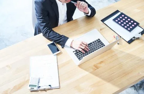 Top angle view of businessman using laptop computer to working at office . Stock Photos
