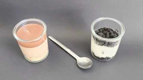 Top-angle view of dessert jars with a spoon Stock Photos