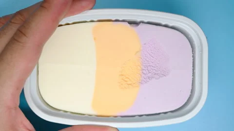 Top angle view eating multi-color ice cream Stock Footage 156902392