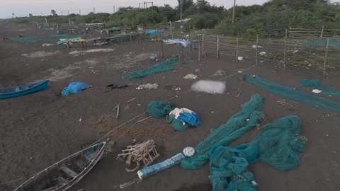 Top angle view of fishing net and other objects on the send at sea coast. Stock Footage 258468293