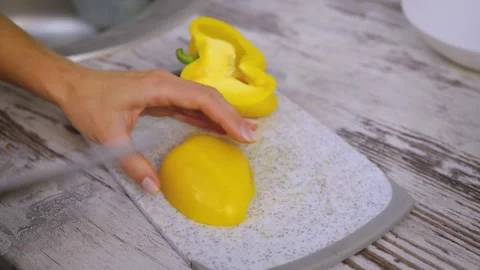 Top angle view zooming out hands with thin long fingers twisting fresh juicy Stock Footage 277078461