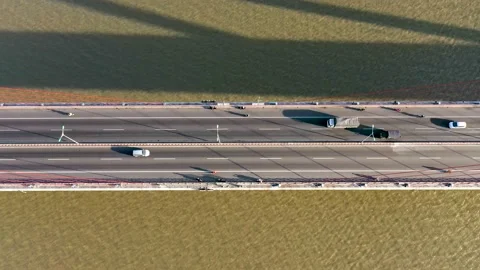 Top ascending aerial view of cable- stayed Can Tho bridge road with driving cars Stock Footage 168407335