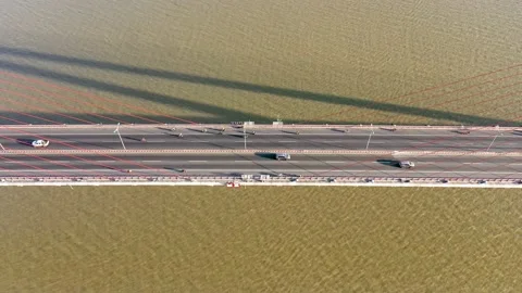 Top ascending aerial view of cable- stayed Can Tho bridge road with driving cars Stock Footage 168407360