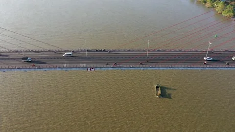 Top ascending aerial view of cable- stayed Can Tho bridge road with driving cars Video stock 168417456