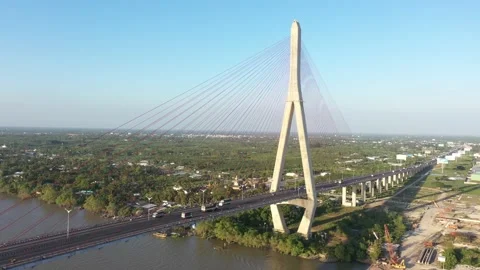 Top ascending aerial view of cable- stayed Can Tho bridge road with driving cars Stock Footage 168423918