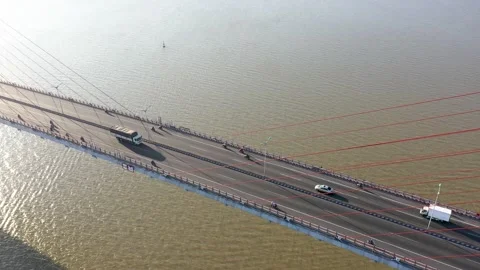 Top ascending aerial view of cable- stayed Can Tho bridge road with driving cars Stock Footage 168423935