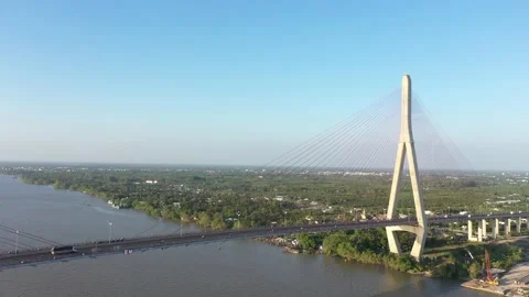 Top ascending aerial view of cable- stayed Can Tho bridge road with driving cars Stock Footage 168424050
