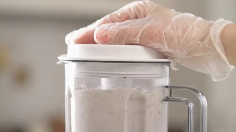 Top to bottom close-up shot of a coconut blending in food processor. Homemade Stock Footage 106205884