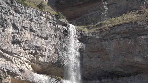 Top-to-Bottom Pan of Mountain Waterfall 動画素材 327055186