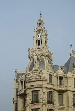 Top of a building with a clock Stock Photos