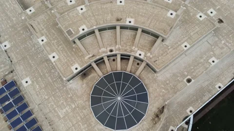 From top of building - Drone moves up, down, and around to show city and river Stock Footage 138877457