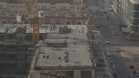 Top of a building under construction, with crane and workers Stock Footage 289722062