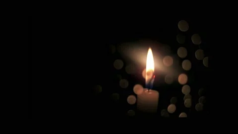 Top of burning candle, fire is twitching in wind, round bokeh from light. Stock Footage 237065677
