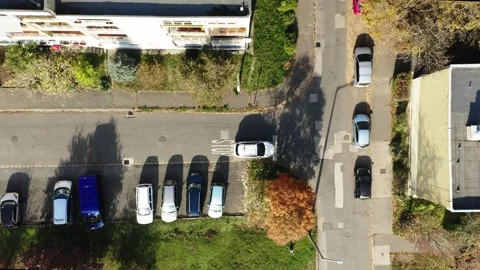 Top camera view of a car stopping perfectly at a stop sign Stock Footage 313010687