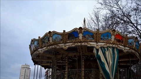 Top of a Carousel Spinning on a City Square Park 動画素材 77950289