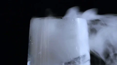 Top of champagne flute as wind blows smoke to the right Stock Footage 70686489