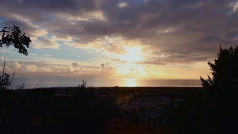 TOP OF CITY SUNSET CLOUD TIMELAPSE Stock Footage