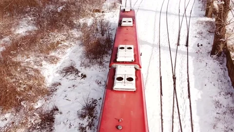 Top close up aerial view of red diesel train roof in the move. Stock Footage 149824908