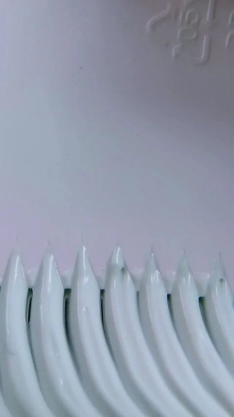 Top close up of creating a zigzag spiral wavy pattern on beauty cream. Deta.. Stock Footage 340012688