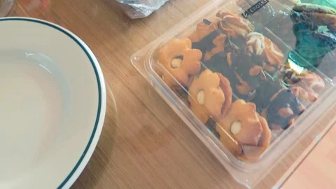 A top close up panning handy view of a breakfast dinning table having Stock Footage 121357661