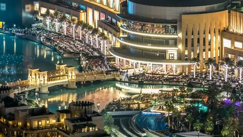 Top close up view of the bridge over man-made lake with music fountain show n Stock Photos