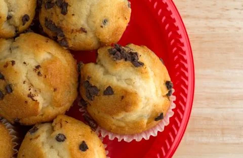 Top close view of muffins on a red plate. Stock Photos