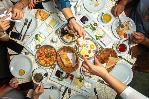 A top close up view table breakfast time family having with different meals Stock Photos