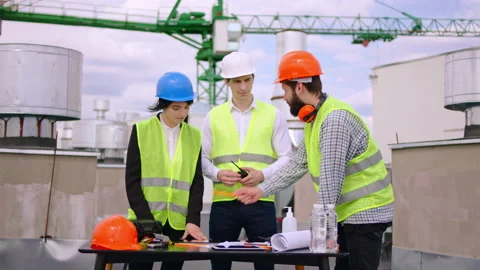 On the top of construction site group of architect and engineer with a pretty Stock Footage 138197903