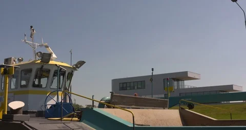 Top deck of a pusher craft being lowered lock chamber Stock Footage 108722323