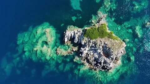 Top down 4K drone view of rocky underwater reef and turquoise sea water in Greec Stock Footage 340568167