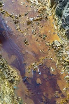 A top down abstract view of a riverbed in an abandoned mining area with mineral Stock Photos