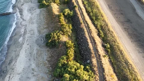 Top Down Aerial 4K View of Rocky Beach Coastline, Waves and Sandy Shore Stock Footage 342024486