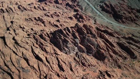 Top down aerial above red sandstone fins in Moapa Valley Nevada desert Stock Footage 264251486