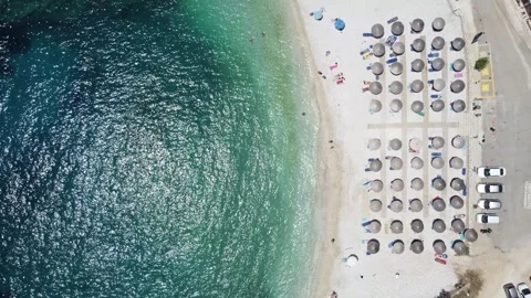 Top-down aerial of Ammoussa Beach in vertical split symmetry, half water half 動画素材 332736141