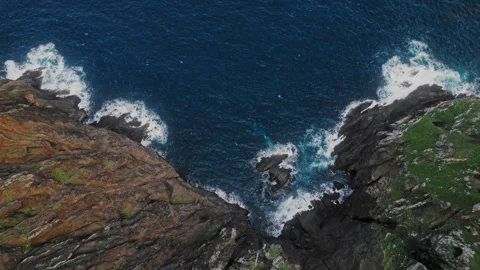 Top down aerial of the Atlantic ocean coast and the mountains of Madeira Stock Footage 303054831