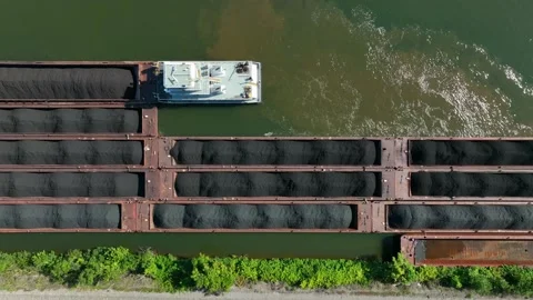 Top down aerial of barge in water. Coal transported on river in USA. Stock Footage 205586889