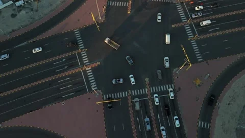 Top-Down Aerial of Busy Multilane Intersection at Golden Hour with Cars Vídeos de archivo 324889789