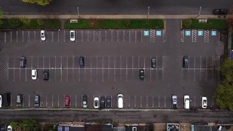 Top down aerial of car parking lot with empty spaces in North America, urban par Stock-Footage 334695564