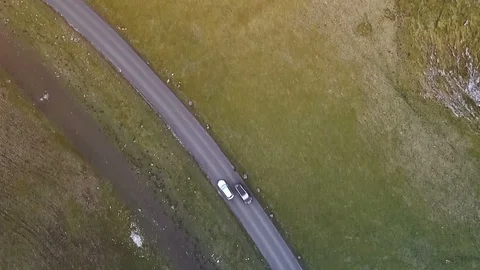 Top down aerial car tracking shot on beautiful country road Stock Footage 105309717