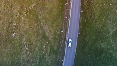 Top down aerial car tracking shot on beautiful country road v3 Stock Footage 105310425