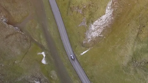 Top down aerial car tracking shot on beautiful country road at sunset Stock Footage 105310769