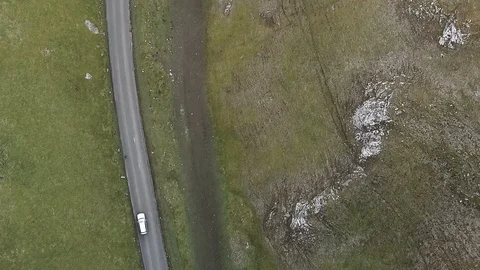 Top down aerial car tracking shot on beautiful country road at sunset v2 Stock Footage 105311308