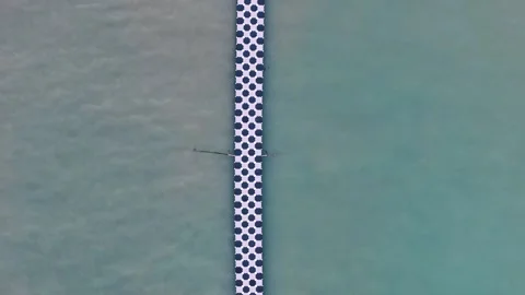 Top down aerial checkered pier at tropical resort Phuket Thailand 動画素材 331478728